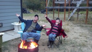 Silly boys... We decided to do a goofy pose for mom. This is our sky's the limit pose. The fire pit was made by a friend of ours who gave it to us as a gift. If you can tell, the fire pit is the bottom fourth of an old pressure tank to regulate domestic water pressure.